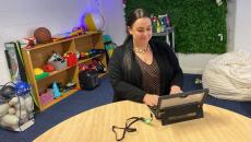 A carer support staff accessing a digital tablet using a passwordless security key